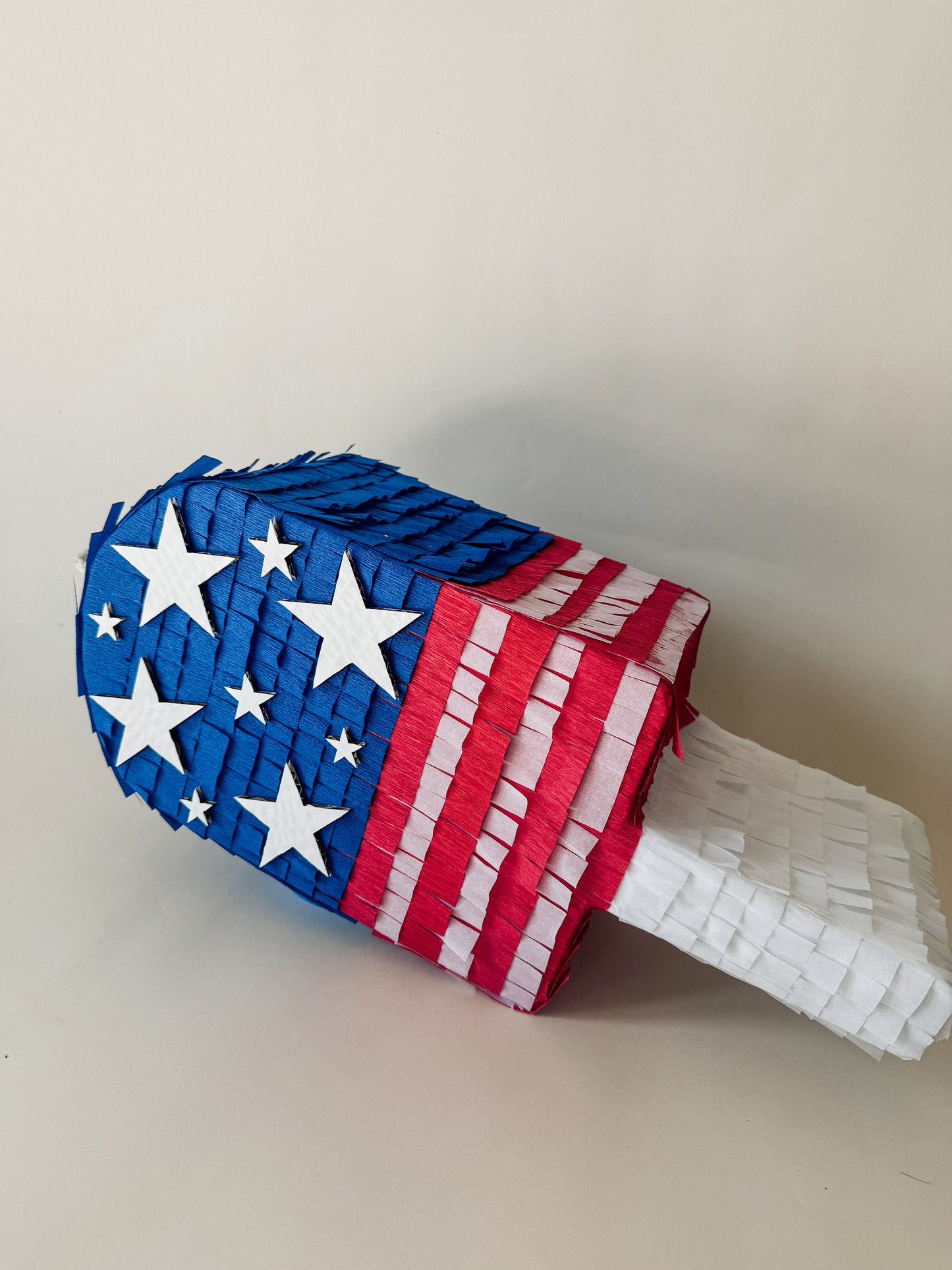 July Popsicle piñata (red,white,blue strips)